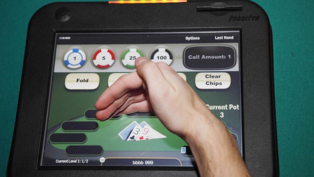 Electronic poker draws crowds, but are machines illegal? | Business