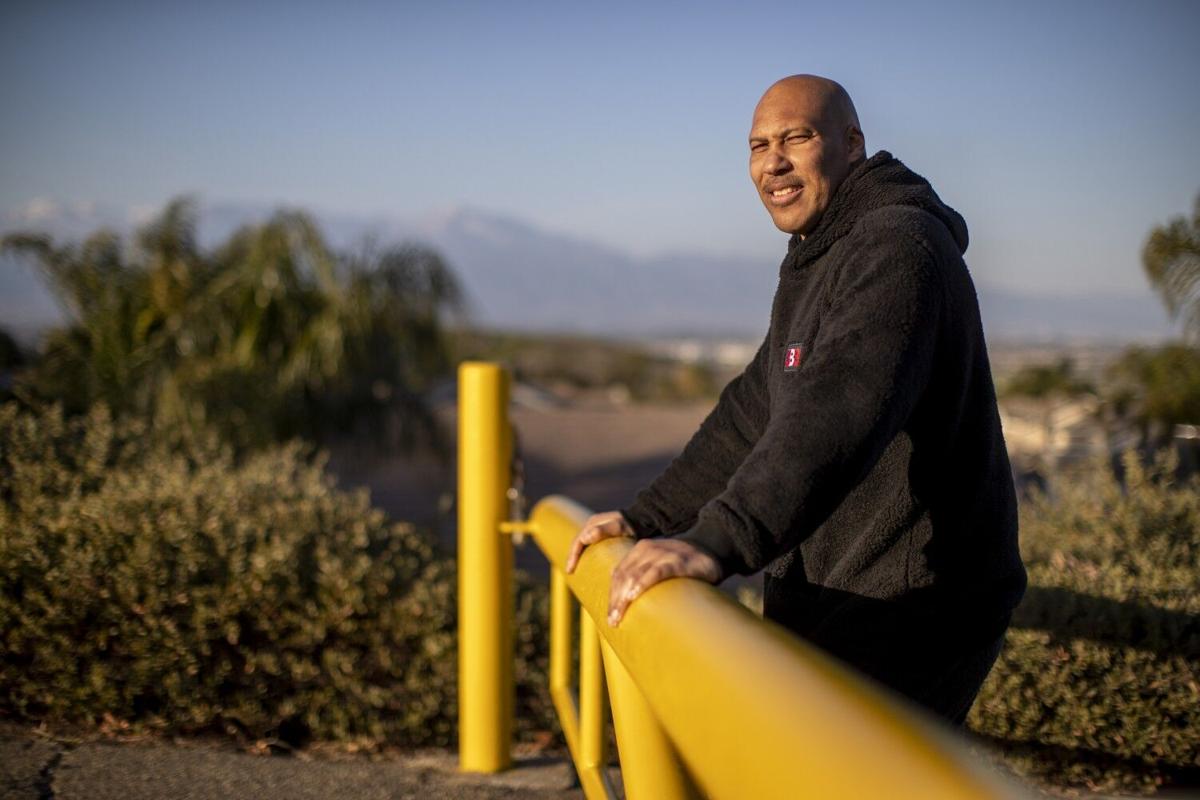CHINO HILLS, CA- MARCH 16, 2021: LaVar Ball stands at a trailhead where he use to train his sons in their early years across from Chino Hills State Park on March 16, 2021 in Chino Hills, California.