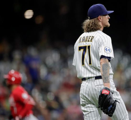 Reds beat Brewers with homer off Josh Hader in game with 3 ejections