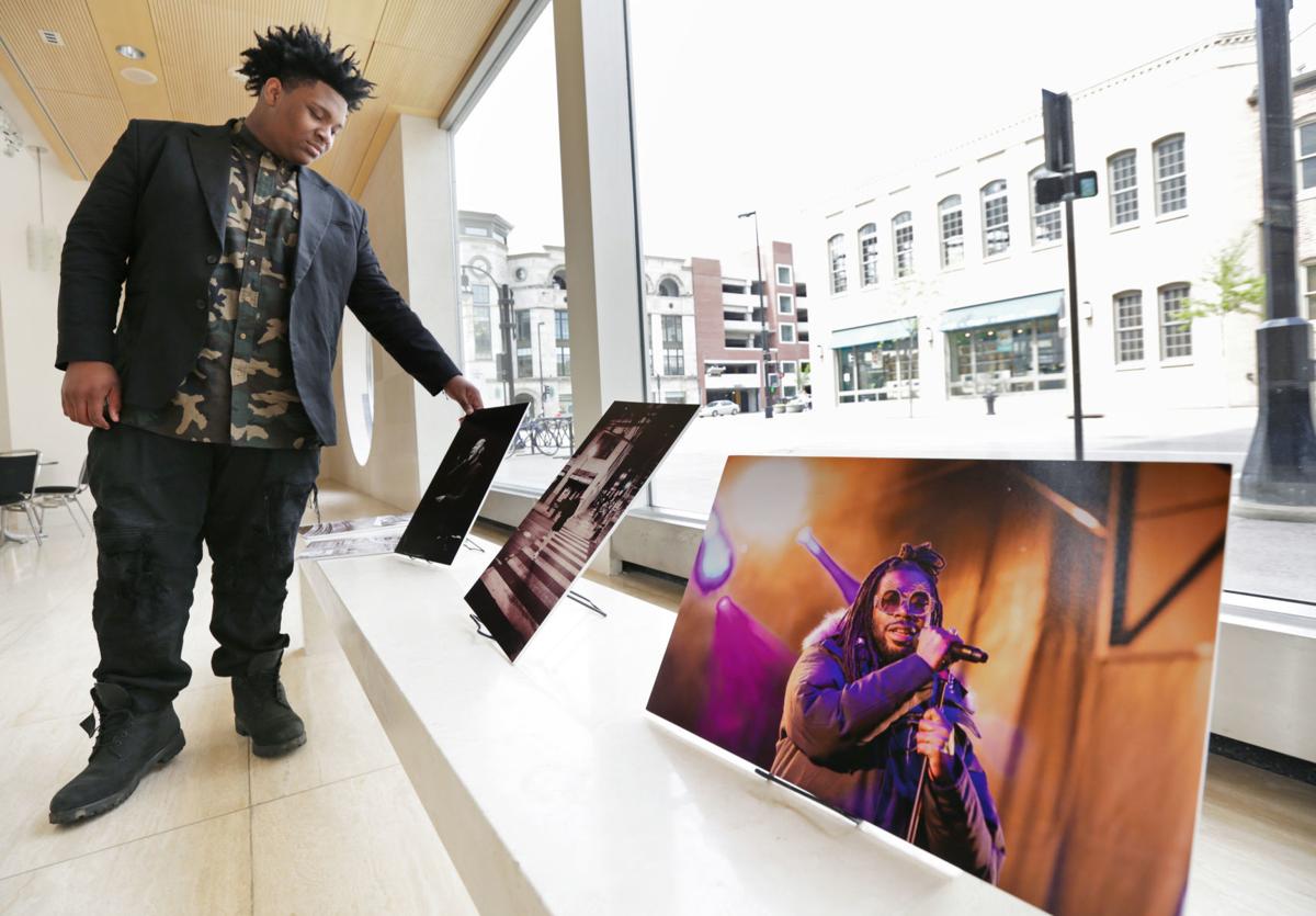 Amadou Kromah with some of his photos