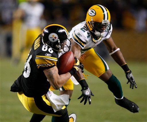 Arizona Cardinals' Larry Fitzgerald aided by Hines Ward