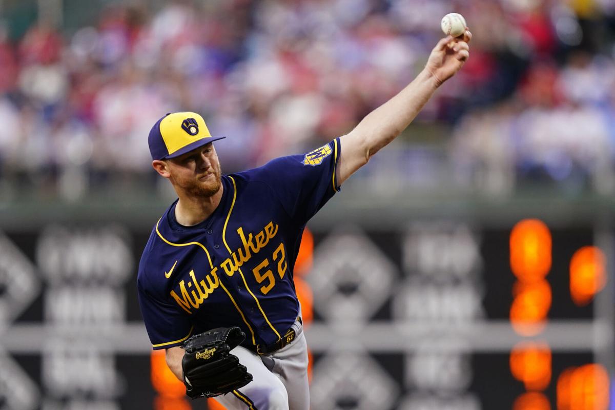 Taylor has key double, Hader saves 100th, Brewers beat Cards