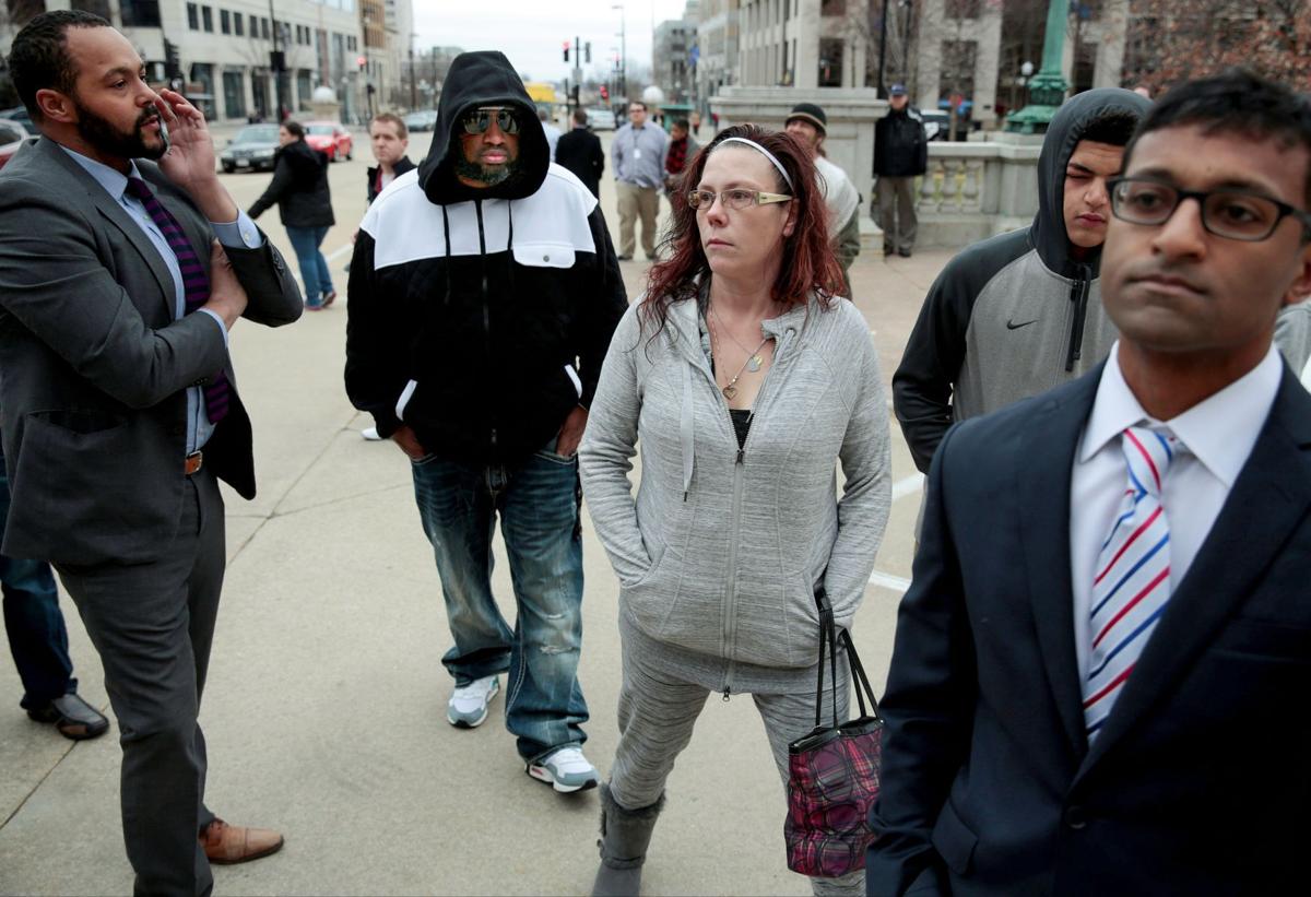Tony Robinson's family and their lawyers arrive for a press conference Feb. 23 at the state Capitol