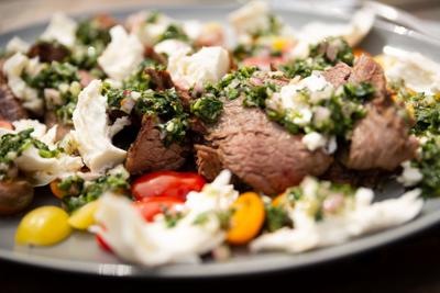 This grilled flank steak salad with chimichurri should be added to your summertime menu today