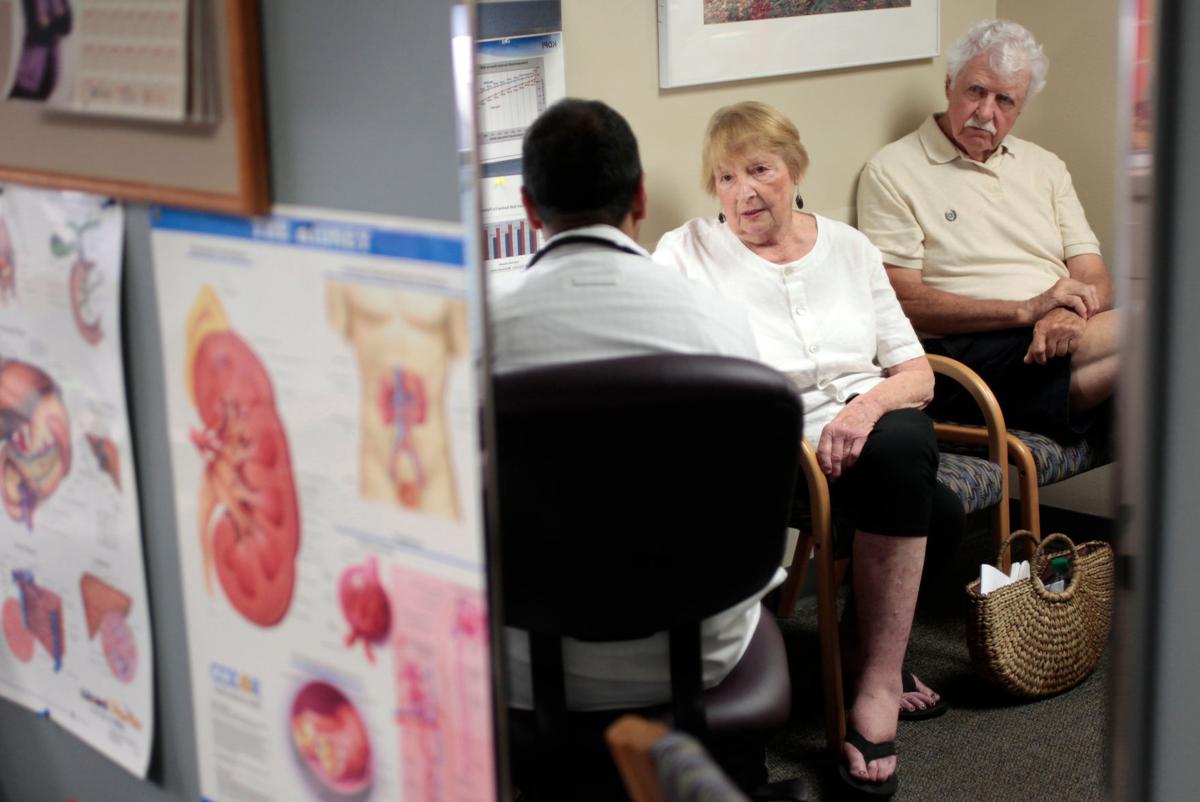 Mitzi Neyens with husband and doctor