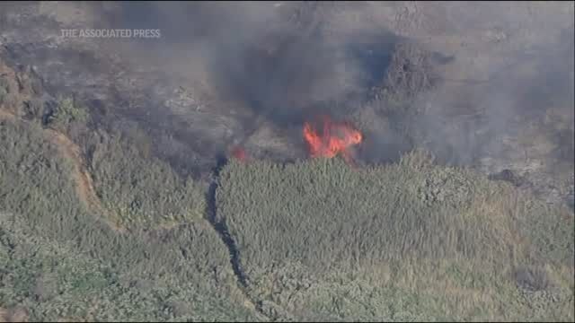 Fire in California river bottom forces evacuations
