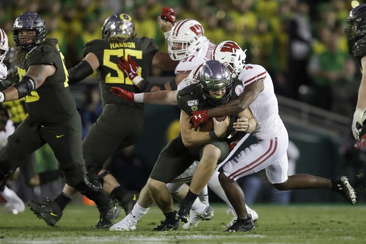 Pasadena, CA. 1st Jan, 2020. Oregon Ducks quarterback Justin Herbert #10  with the trophy after winning the 106th Rose Bowl College football game  between the Oregon Ducks and the Wisconsin Badgers at