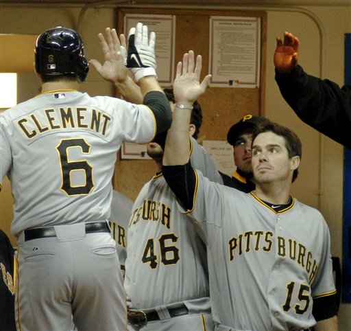 The ball hit by Milwaukee Brewers' Prince Fielder gets by Pittsburgh  Pirates first baseman Ryan Doumit in the first inning of the first game of  a scheduled double header baseball game in