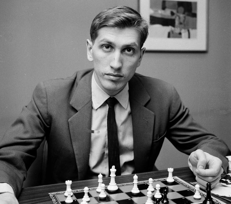 Chess champion Bobby Fischer working on his moves during a subway