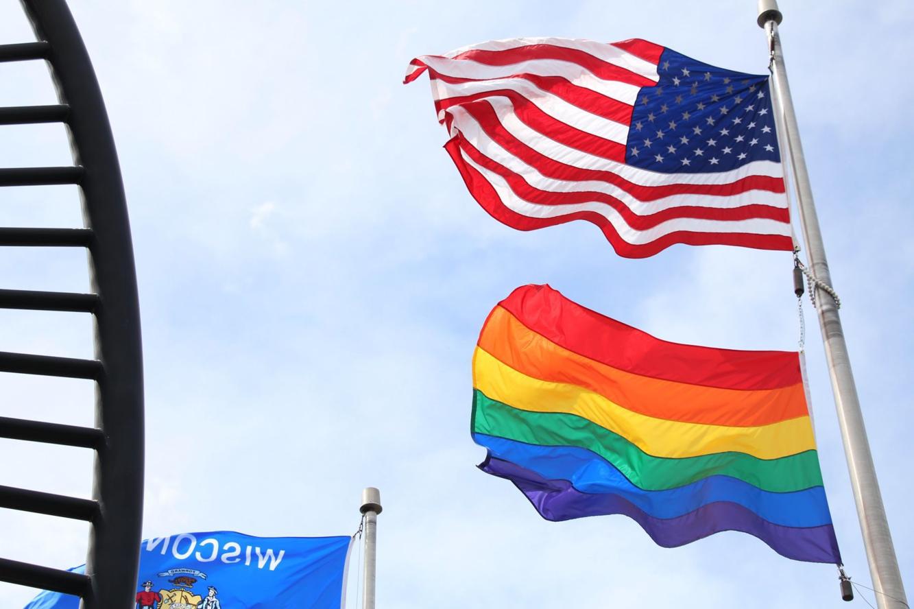 UWMadison raising pride flags over Memorial Union, Union South