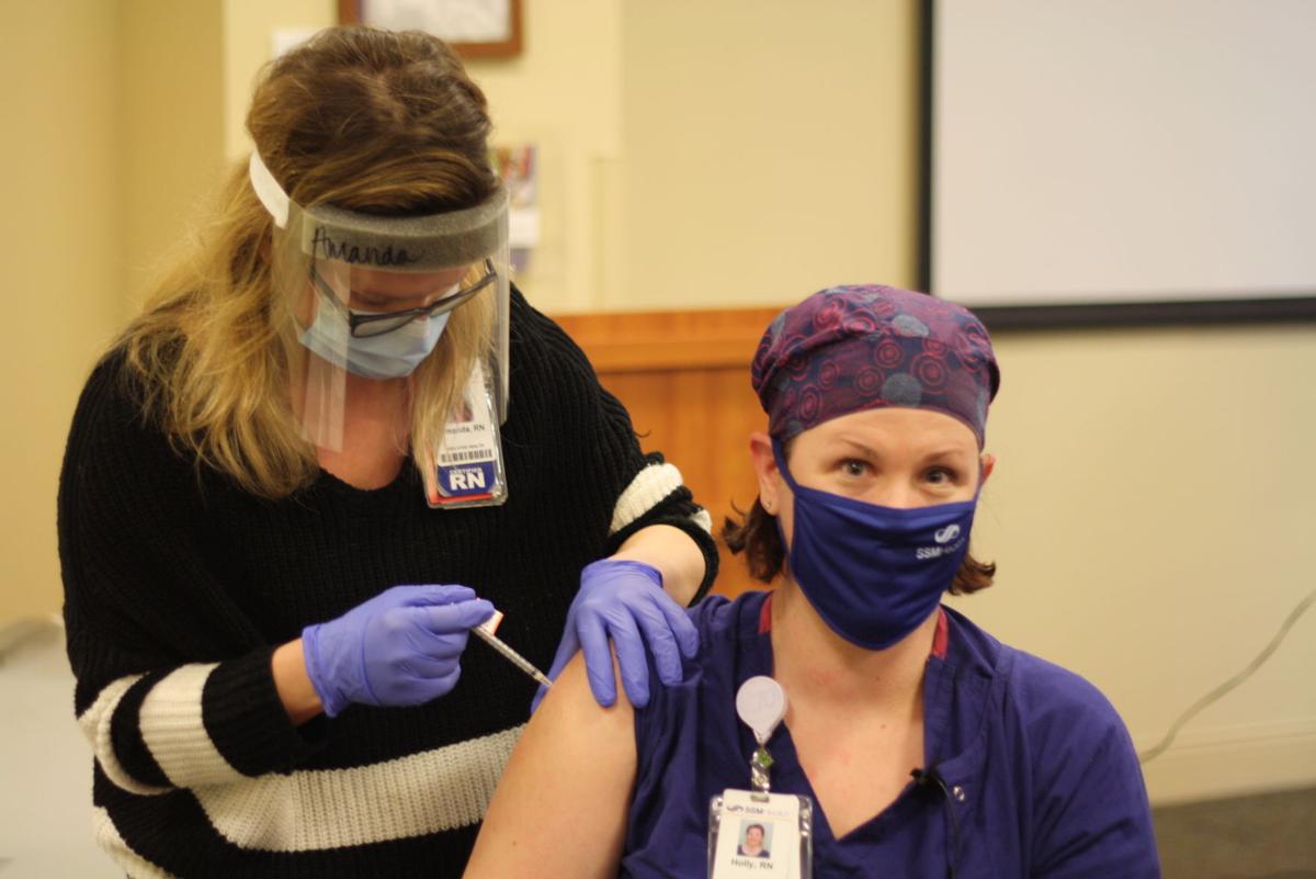 SSM Health worker getting COVID-19 vaccine