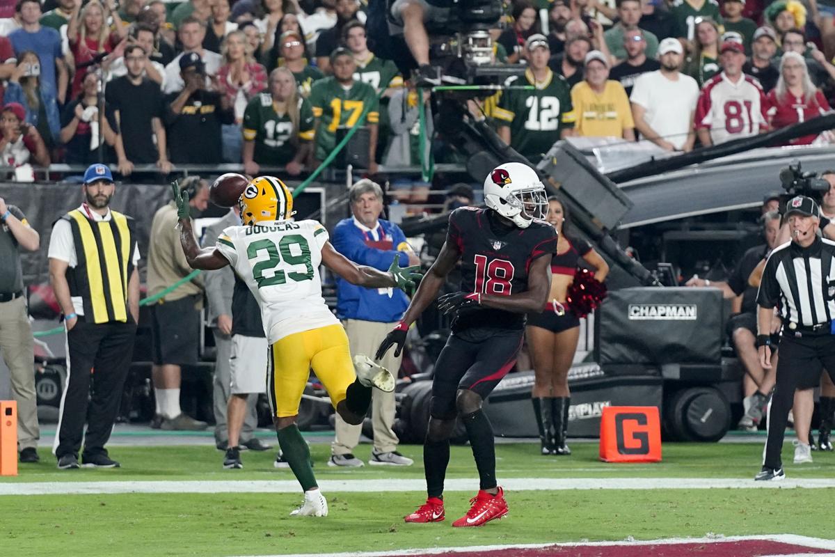 Arizona Cardinals' Isaiah Simmons (9) and Jordan Hicks celebrate a  defensive stop against Green Bay in the first half of an NFL football game  Thursday, Oct. 28, 2021, in Glendale, Ariz. (AP