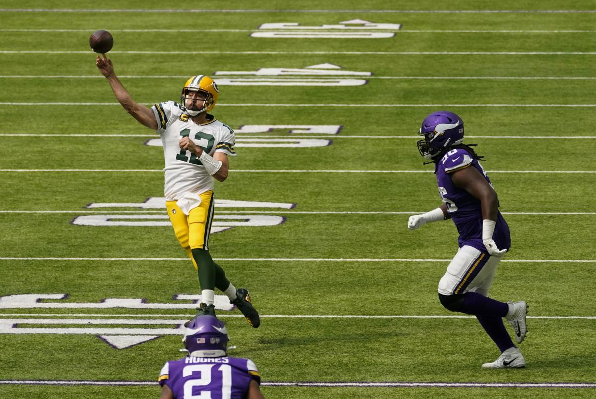 Packers QB Aaron Rodgers throwing a pass in Week one of 2020