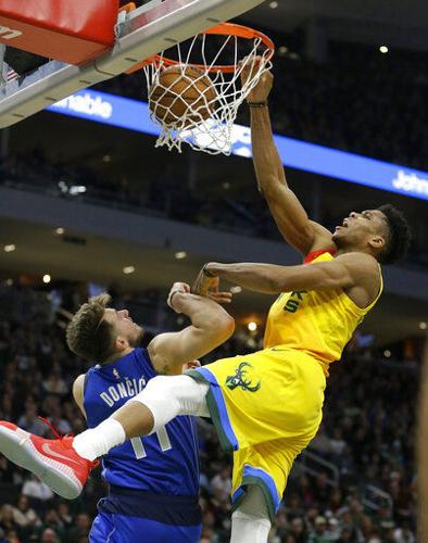 Giannis Antetokounmpo has great reaction to brother's monster dunk