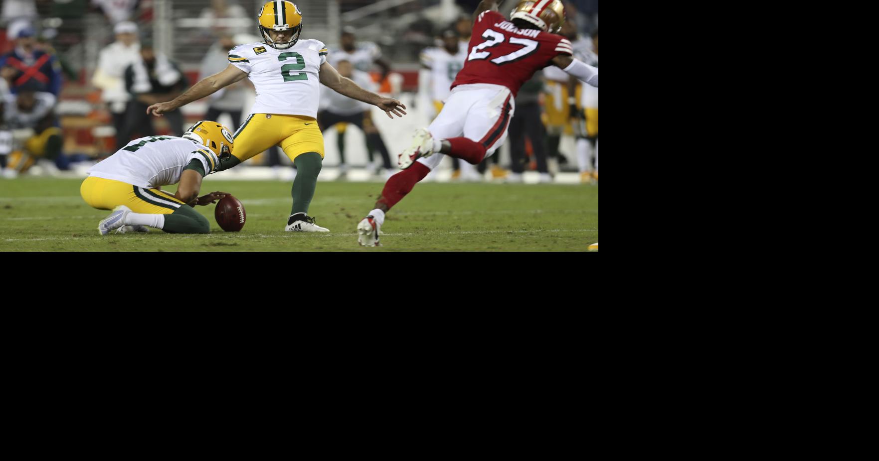 Santa Clara, CA, USA. 26th Sep, 2021. Green Bay Packers' AJ Dillon (28) is  tackled by San Francisco 49ers' Azeez Al-Shaair (51) and San Francisco 49ers'  Emmanuel Moseley (4) after a pass