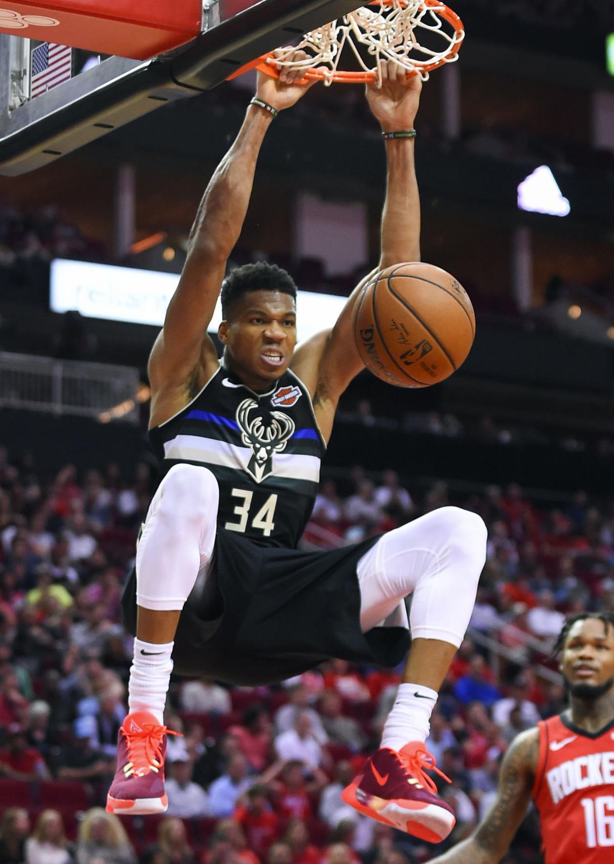 Giannis Antetokounmpo fouls out after triple-double as Bucks rally past Rockets in season opener ...
