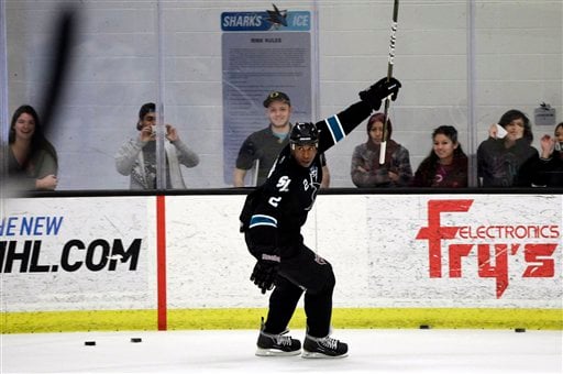 Milwaukee Brewers' Tony Plush (Nyger Morgan) puts on his skates with Sharks