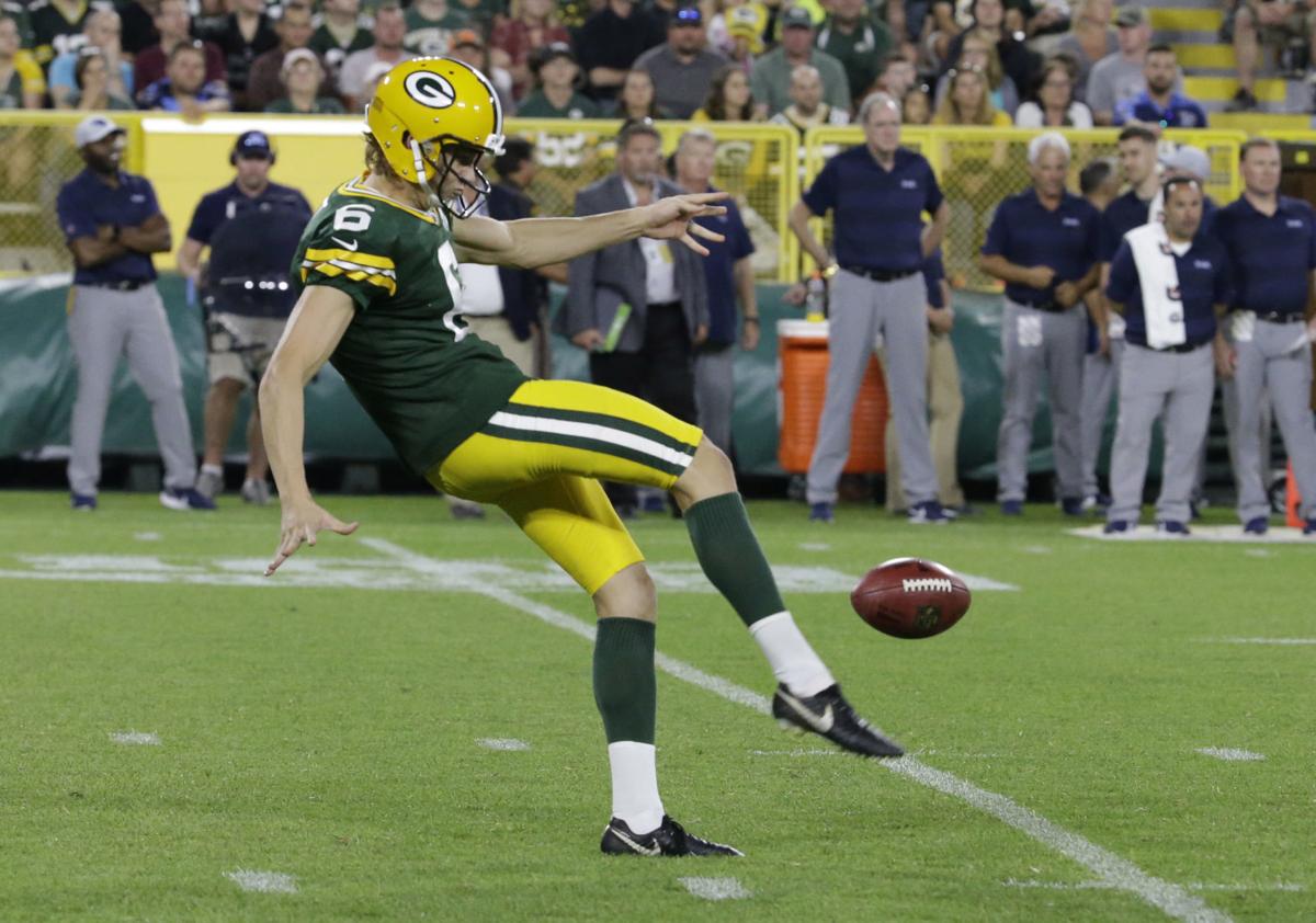 JK Scott punting, AP file photo
