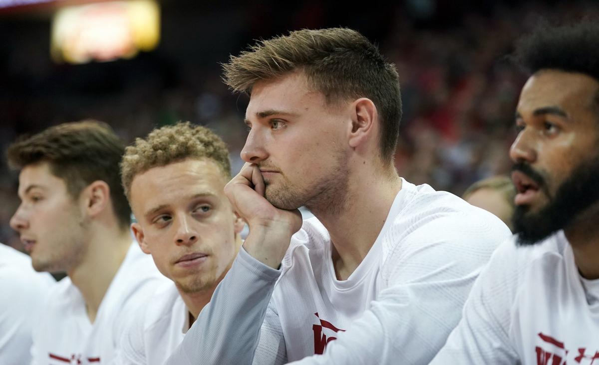 Micah Potter sits on the bench