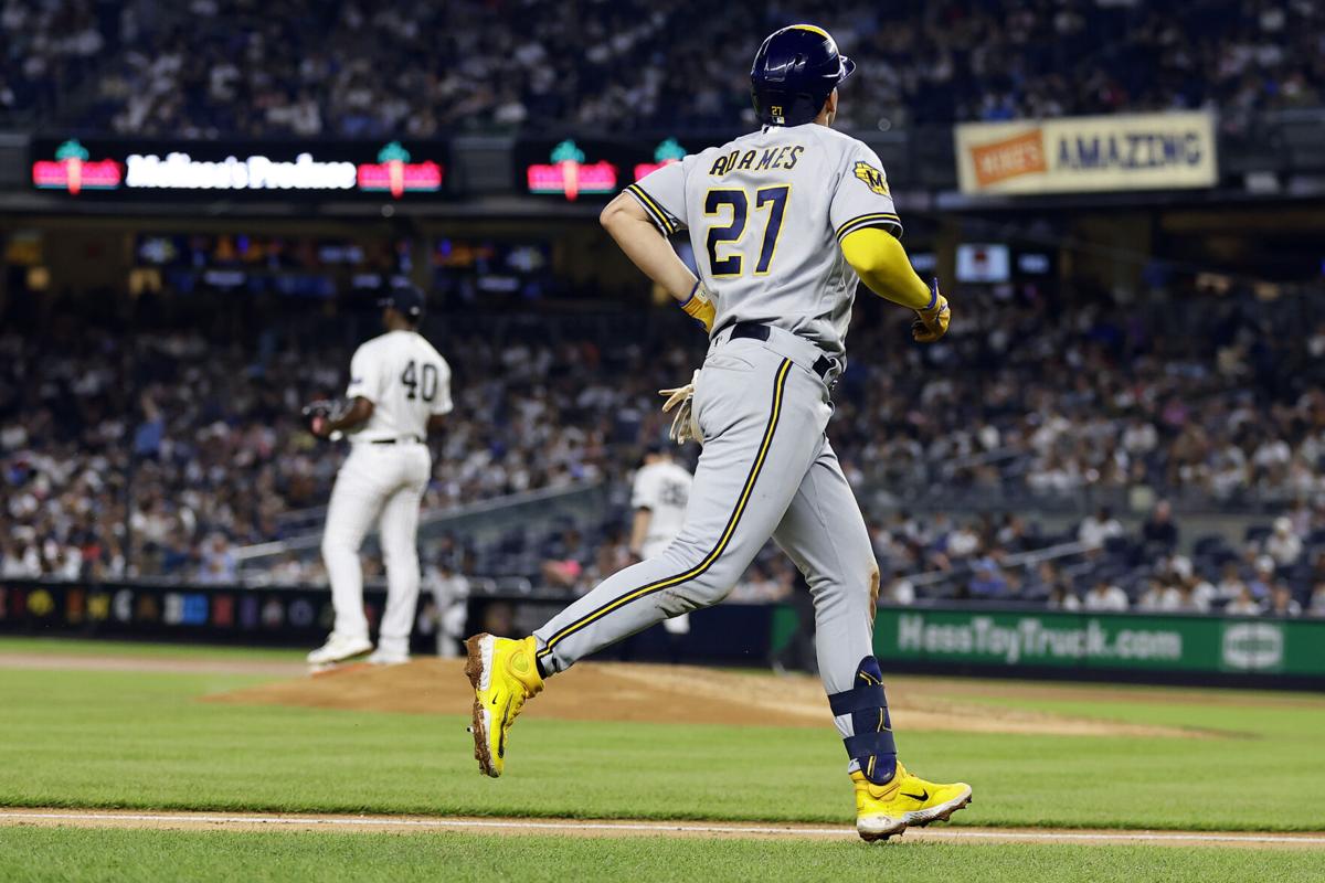 Jesse Winker leads 13-hit attack, Brewers beat Cubs in rubber game of series