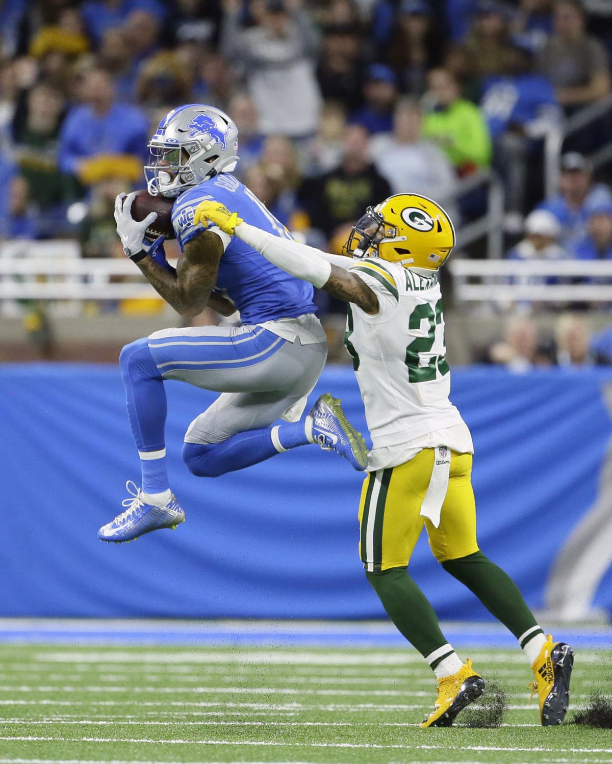 Green Bay Packers cornerback Jaire Alexander (23) breaks up a pass intended  for wide receiver Allen Lazard (13) during an NFL football training camp at  Lambeau Field Saturday, Aug. 7, 2021, in