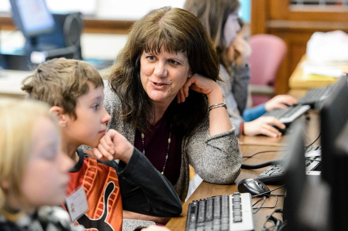 Professor Andrea Arpaci-Dusseau works with students