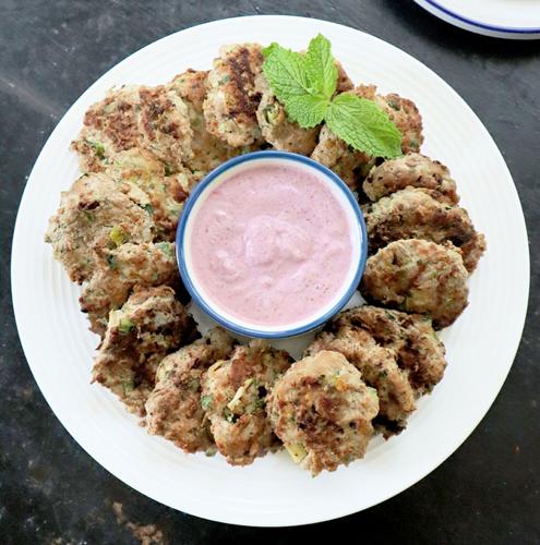 Served with a tangy, purple sumac sauce, these gluten-free turkey meatballs include a secret ingredient that's plentiful in later summer— shredded zucchini.