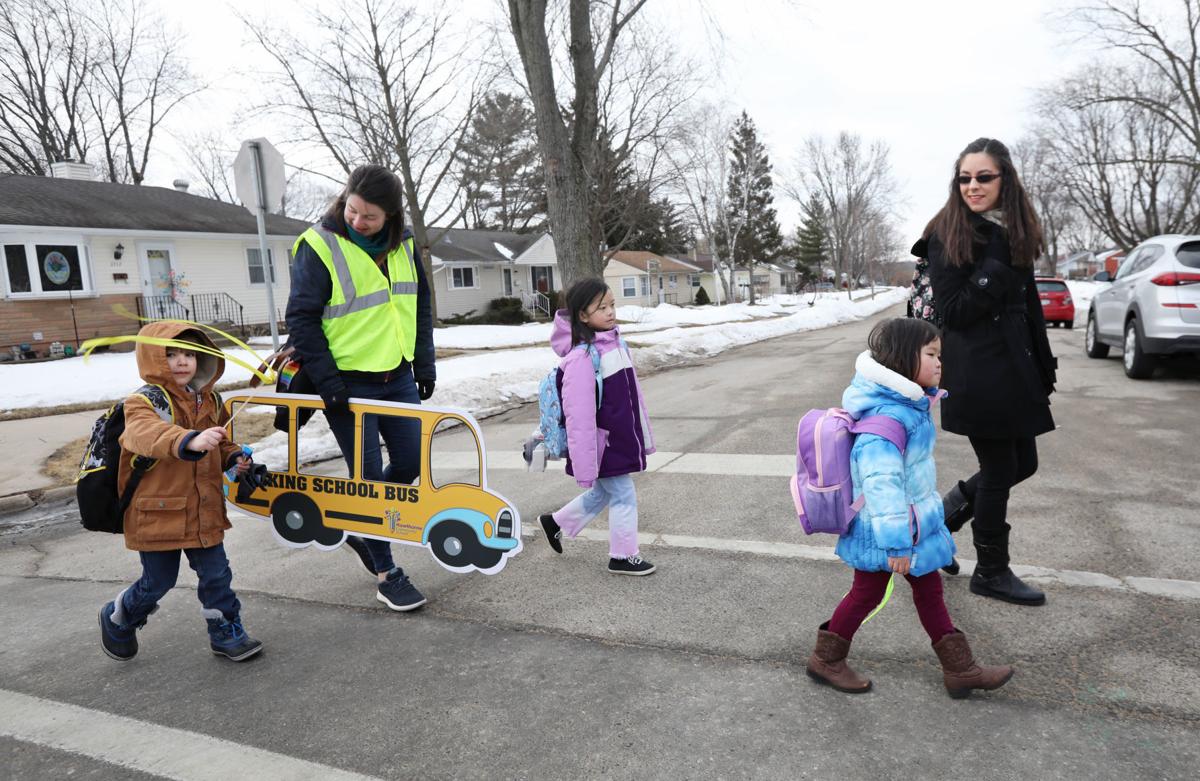 Walking school bus with sign