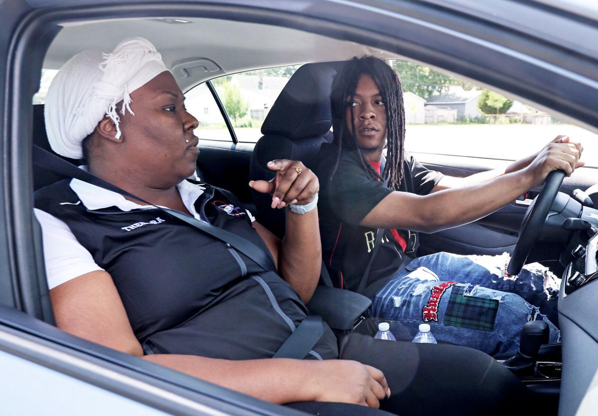 Thedora Smith, drive coordinator with Operation Fresh Start, left, instructs Sincere Townsel as part of a behind-the-wheel driving lesson. Photo copyright Wisconsin State Journal.