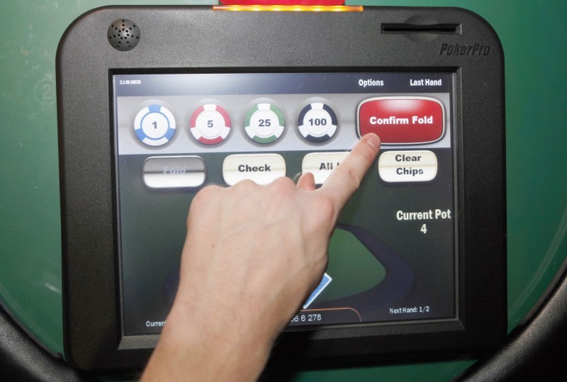 Electronic poker draws crowds, but are machines illegal? | Business