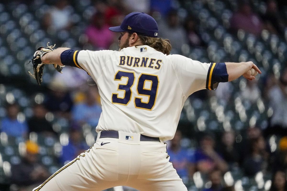 Milwaukee Brewers catcher William Contreras, left, congratulates relief  pitcher Devin Williams on his save after a victory over the San Diego  Padres, Sunday, April 16, 2023, in San Diego. (AP Photo/Brandon Sloter