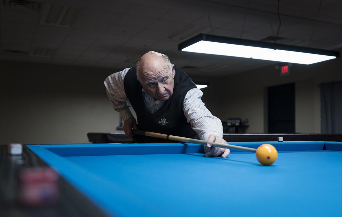 Bob Keller plays a game of billiards at Three Cushion Billiards in