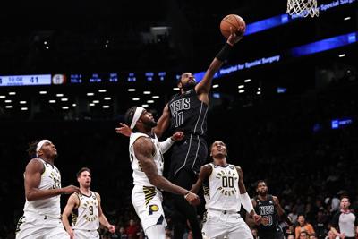 Kyrie Irving of the Brooklyn Nets attempts a layup during the second quarter of the game against the Indiana Pacers at Barclays Center on October 31, 2022, in New York City.