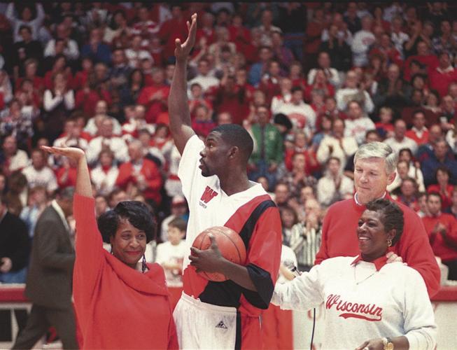 Former Wisconsin basketball player Michael Finley addresses the media  before an NCAA college basketball game between Wisconsin and Michigan  Sunday, Feb. 20, 2022, in Madison, Wis. Finley's jersey number was retired  at