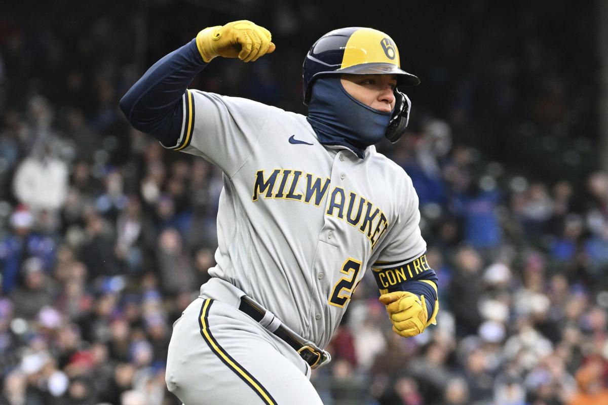 Brewers rally with 3-run eighth inning for first win of season