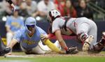 Reds turn back Brewers' wild comeback in ninth inning
