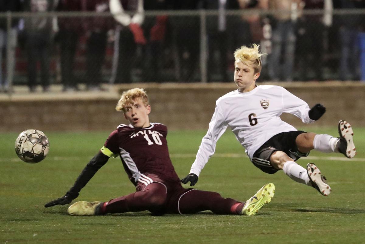 WIAA state boys soccer: Oregon's Carter Hendrickson takes a spill along with Holmen's Braydon Kreibich