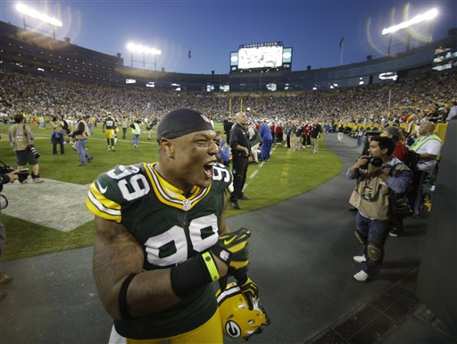 Referee Jeff Triplette signals New Orleans Saints' possession, after a  video review, during the second half of the Saints' NFL football game  against the Green Bay Packers on Sunday, Sept. 30, 2012