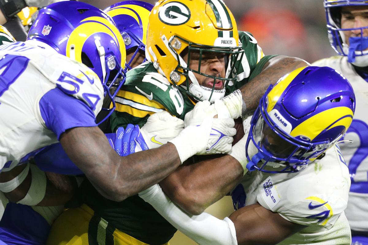 AJ Dillon helps Packers power past Rams, 36-28, as Aaron Jones returns