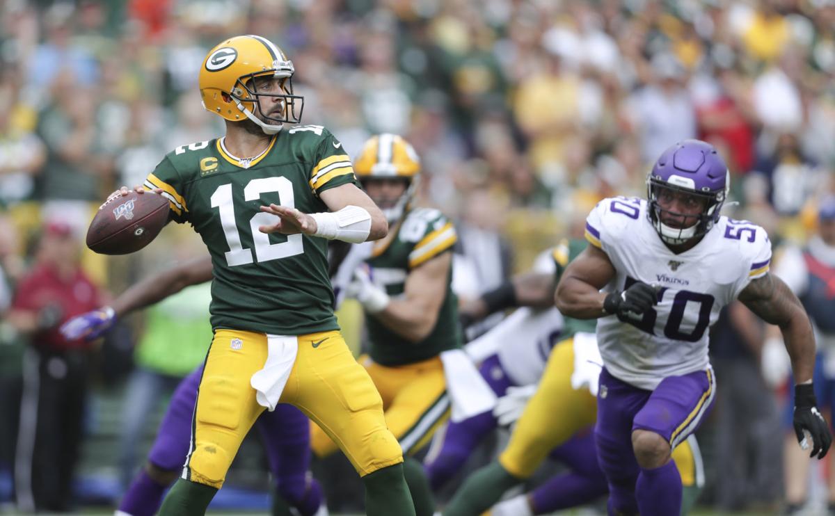 Aaron Rodgers against Vikings, State Journal photo