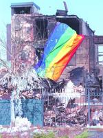 Gutted hotel with flag
