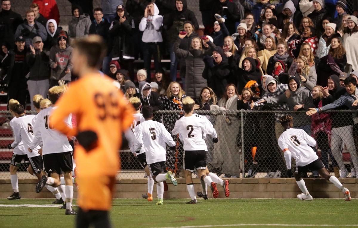 WIAA state boys soccer: Oregon players celebrate a score with their fans