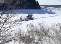 Grooming the snowmobile trail