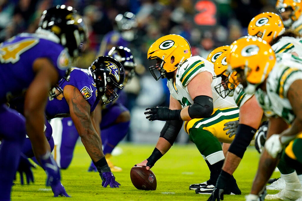 BALTIMORE, MD - DECEMBER 19: Packers running back A.J. Dillon (28) runs the  ball during the Green Bay Packers versus Baltimore Ravens NFL game at M&T  Bank Stadium on December 19, 2021