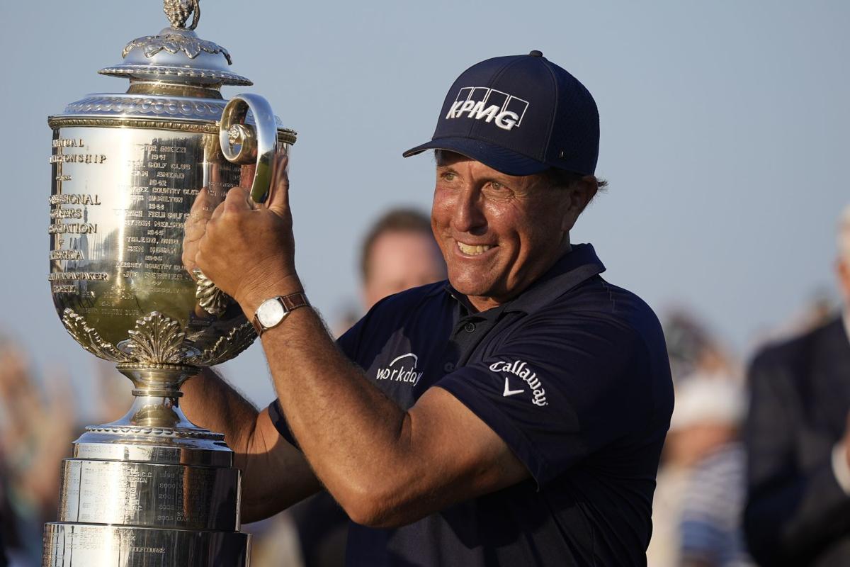 Phil Mickelson with PGA Championship trophy, AP photo
