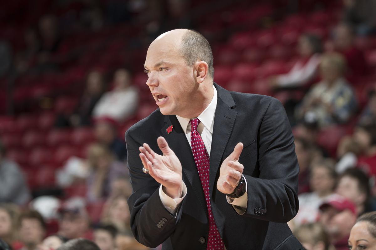 Jonathan Tsipis clapping on sidelines, UW photo, GREAT FOR WEB