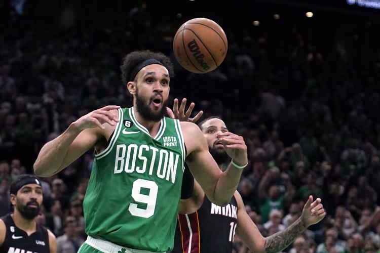 Miami Heat forward Caleb Martin (16) shoot against Boston Celtics