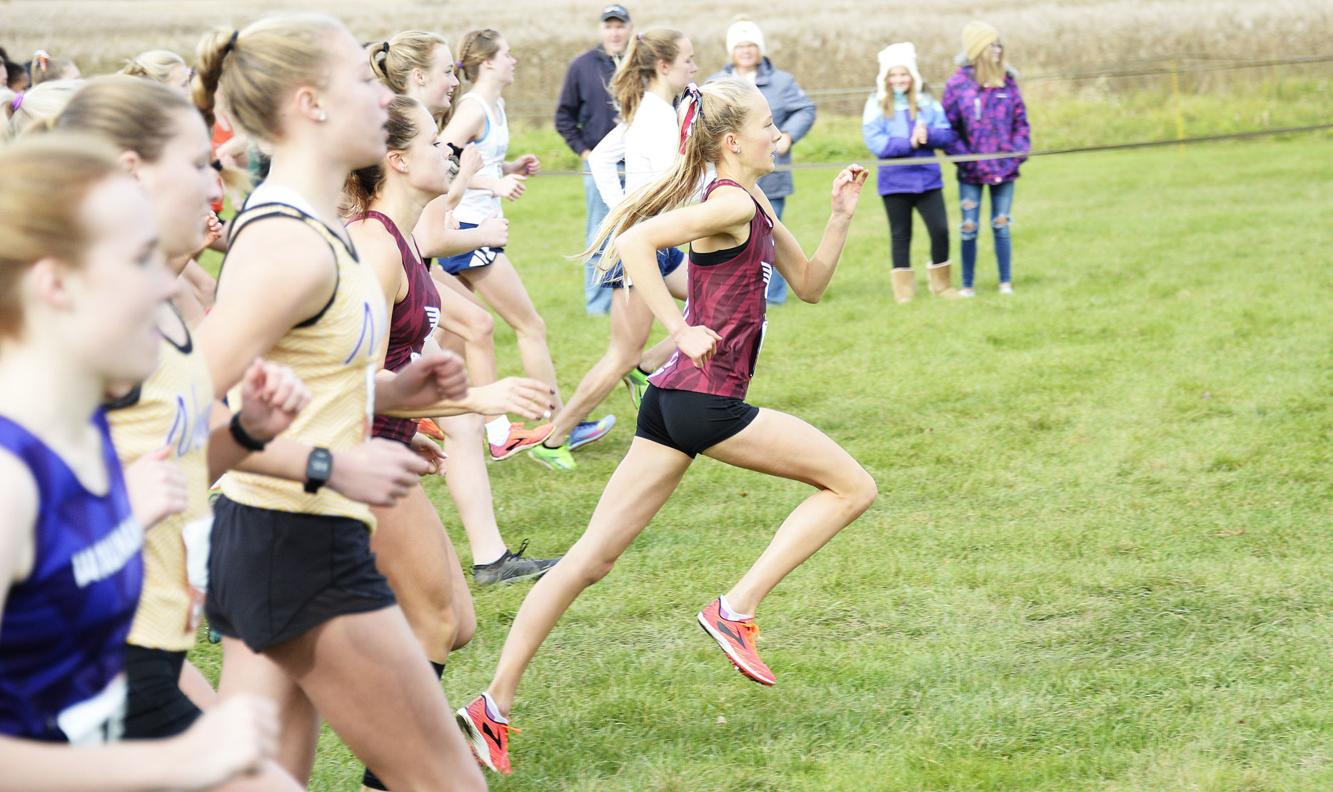 WIAA cross country DeForest's John Roth does the paperwork, then the
