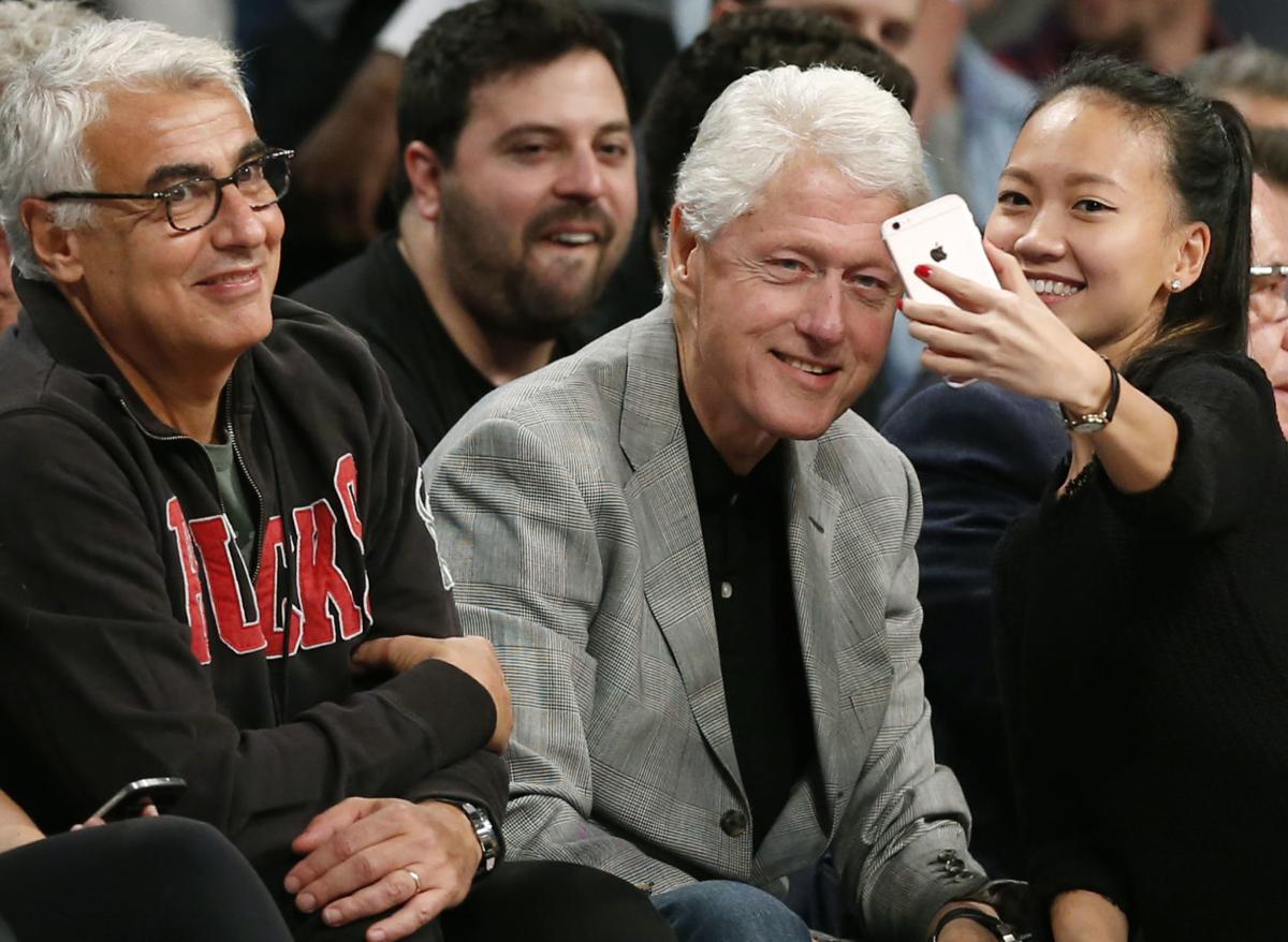 Marc Lasry, Bill Clinton, AP photo