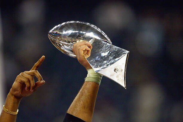 The Vince Lombardi Trophy for Super Bowl XLIII is on display along with  helmets for the Pittsburgh Steelers (L) and Arizona Cardinals as NFL  Commissioner Roger Goodell holds a news conference to